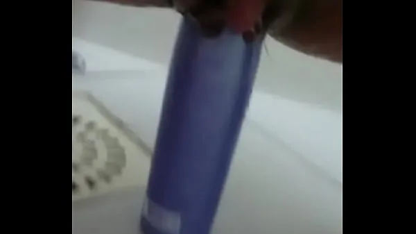 HD Stuffing the shampoo into the pussy and the growing clitoris power Videos