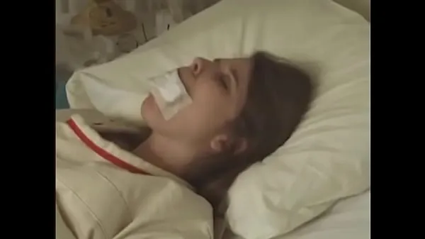 مقاطع فيديو عالية الدقة Pretty brunette in Straitjacket taped mouth tied to bed hospital