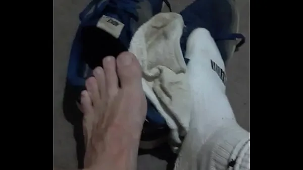 HD Taking off dirty socks to let the smell out power Videos